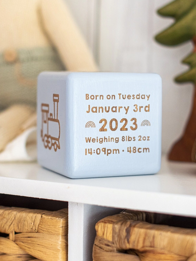 Giant wooden baby block with birth statistics in blue