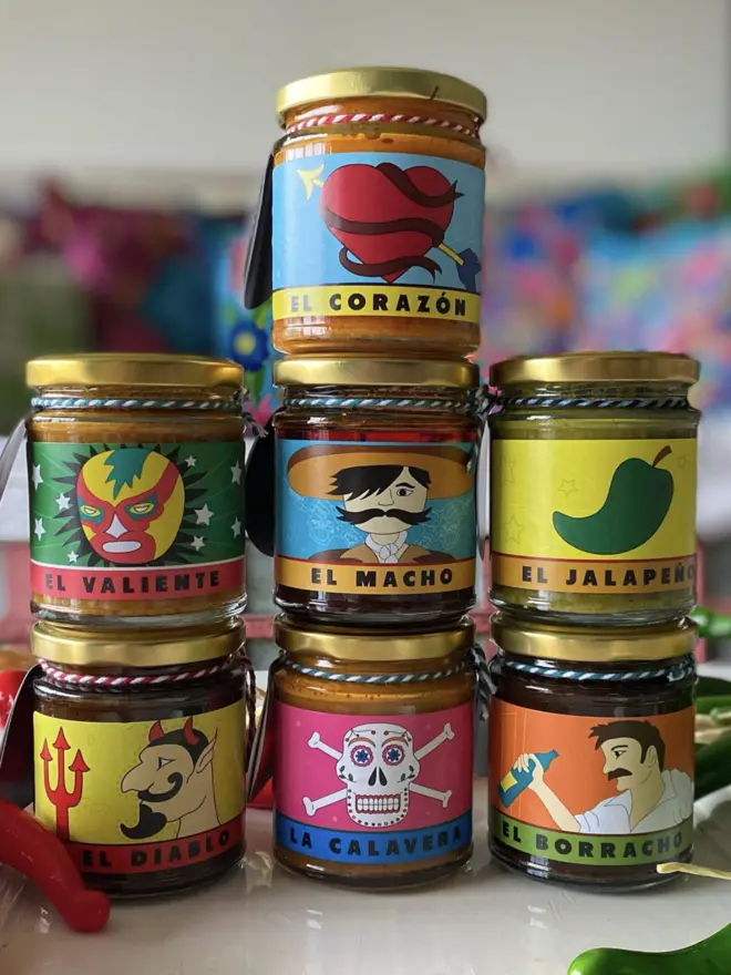 pyramid stack of 7 miski sauces, all with loteria style packaging