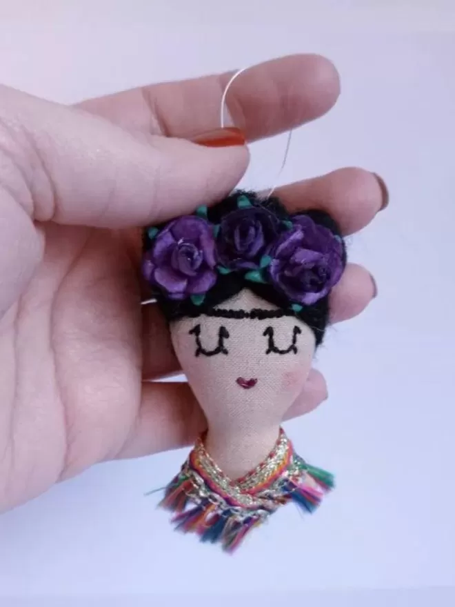 Frida Khalo hanging Christmas decoration