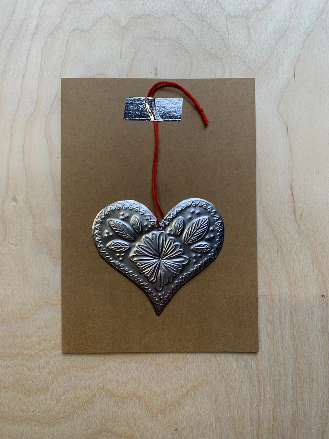 Embossed tin heart susan bradley