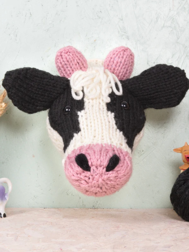 Dairy Cow Head Knit Kit. A giant dairy cow head, completed and mounted.