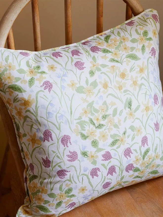 Oxford Meadow linen piped cushion on wooden chair