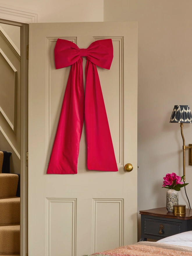 Handmade velvet door bow in warm tones rust coral dusky pink and hot pink, also suitable as Christmas tree topper, Kika Bespoke