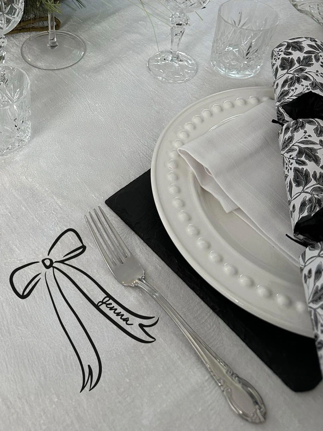 personlaised Bow tablecloth place name sticker black on a white tablecloth