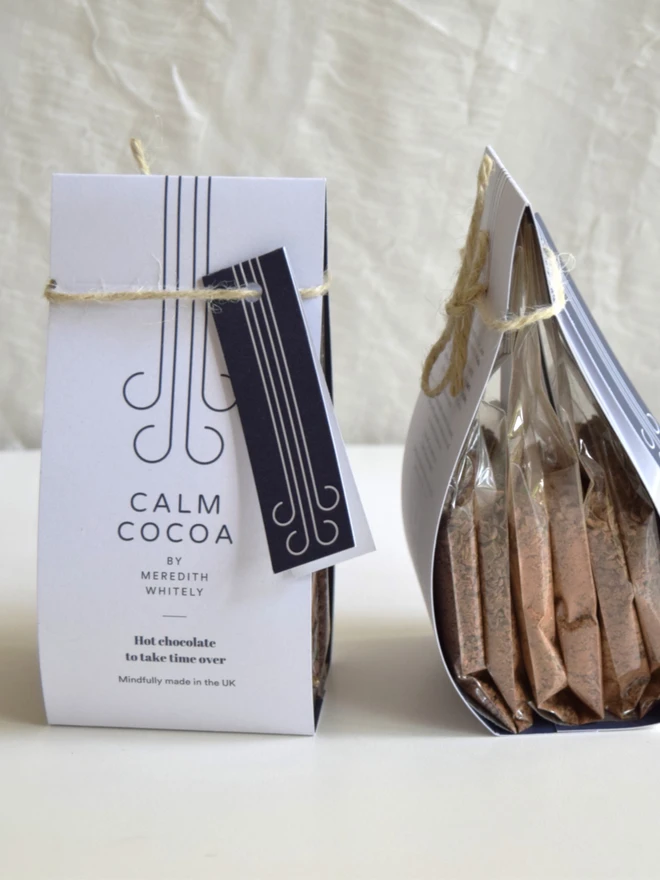Two trio packs of Calm Cocoa hot chocolate in large label with gift tag