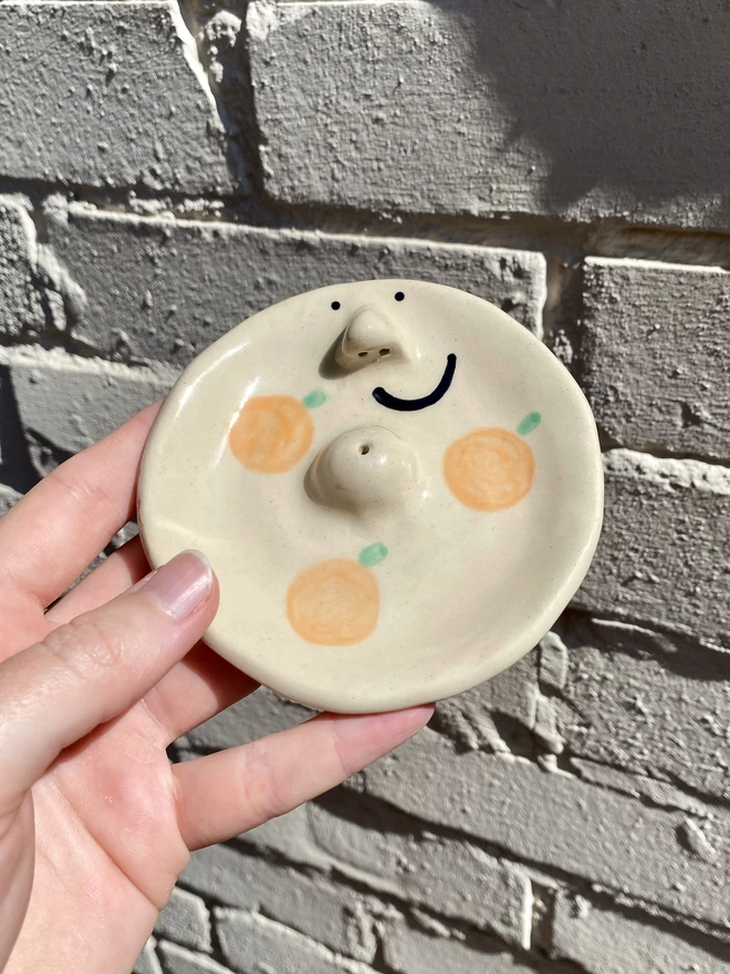 orange incense dish