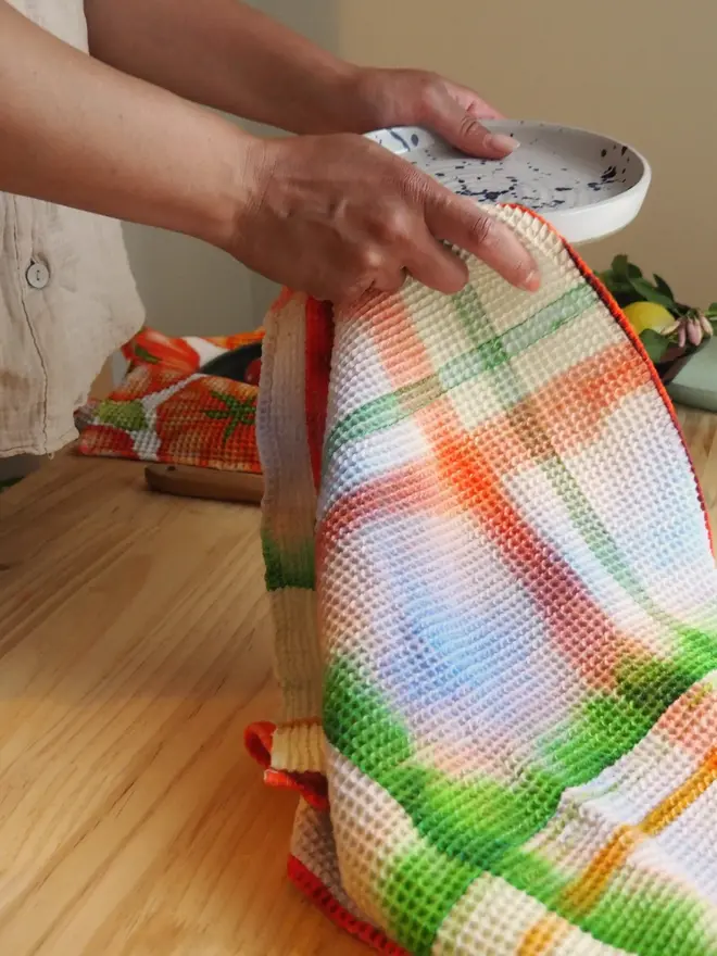 Check Waffle Tea towel, wiping a plate. 