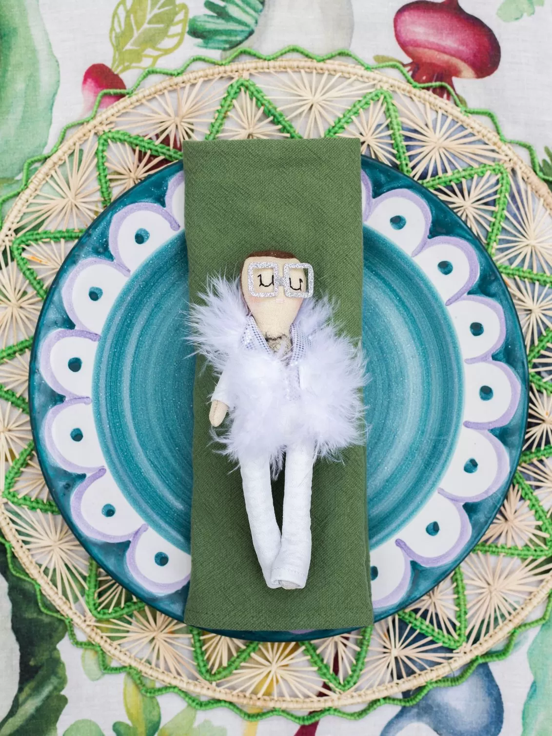 Elton John Jennifer Jackson doll seen on a table setting.