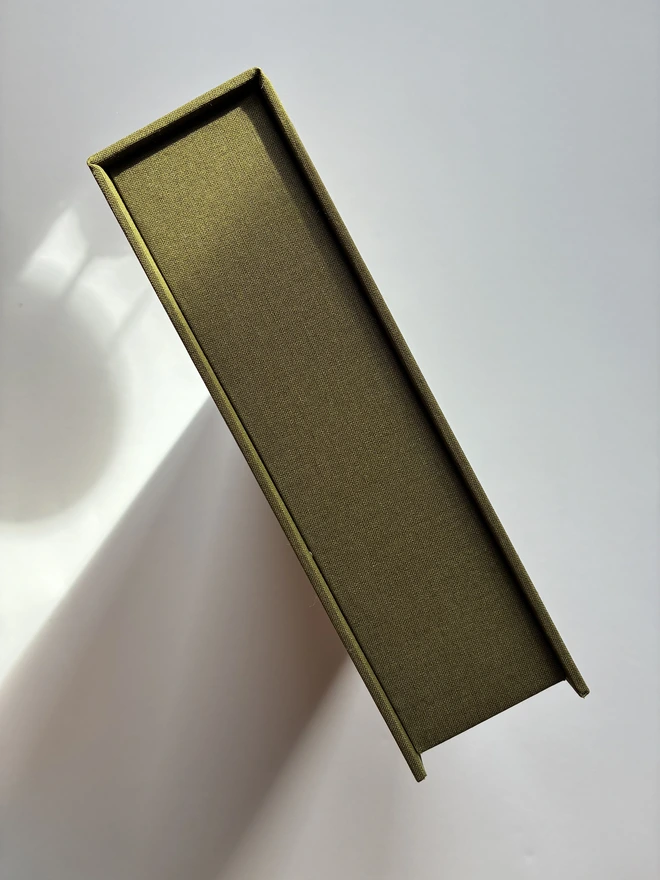 Closed view of handmade Christmas correspondence box in Olive green linen cloth