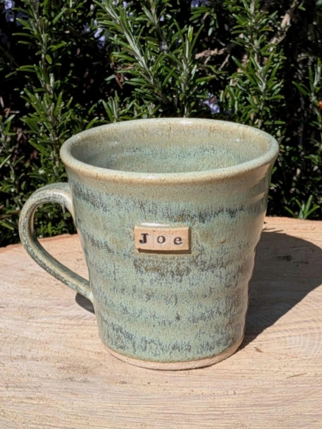 Personalised Ceramic Tea Mug. A mug in meadow green.