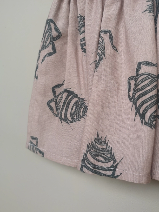 Girls Cotton Linen Pink Woodlouse Print Skirt. Elasticated Waist and Side Seam Pockets.