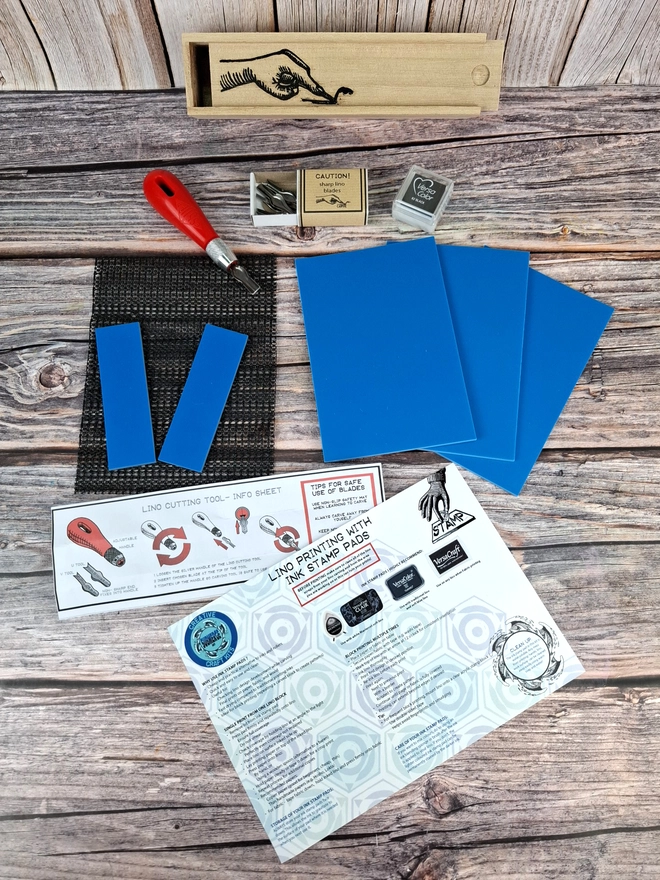 Lino carving and printing kit in wooden box with blue soft lino and versicolor ink pad