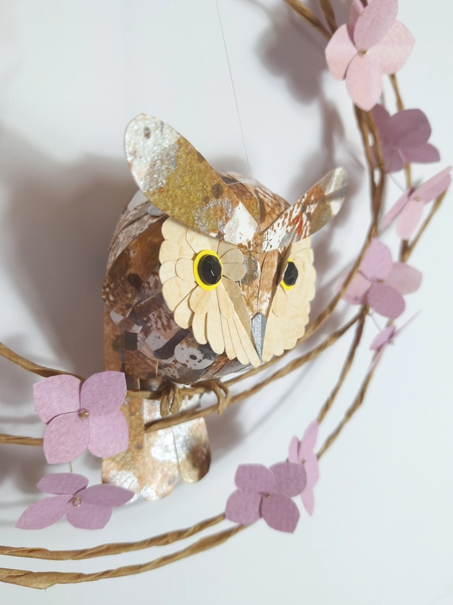 handmade paper sculpture of a long eared owl baby