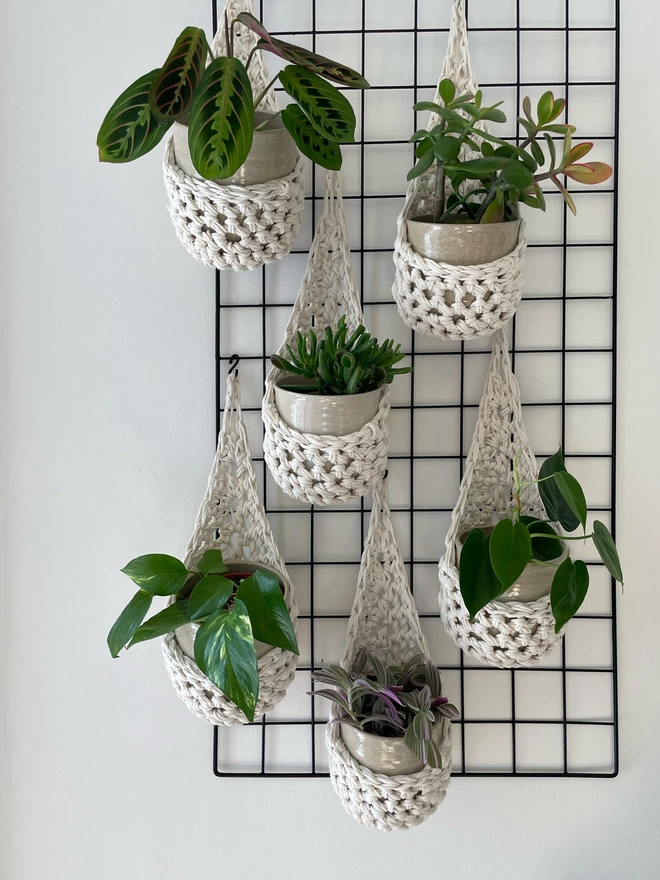 indoor small white cotton hanging wall planter, white fabric wall mounted plant holder, handmade crochet plant basket, handmade sustainable crochet decor, rustic natural organic homeware accessories, hanging plant pot holder