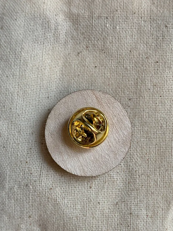 reverse of wooden pin badge