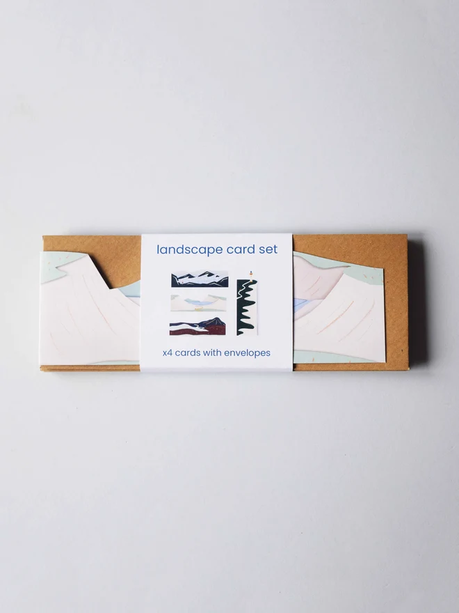 Cut out landscape card bundle laid flat with envelopes and a label