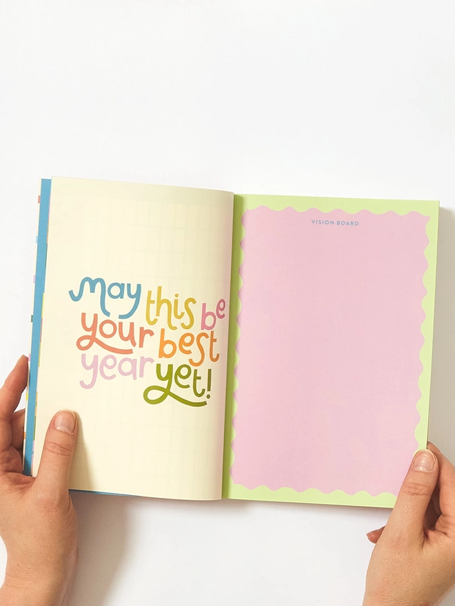 Inside daily planner includes a space for a vision board, and a colourful typographic 'May this be your best year yet!' quote