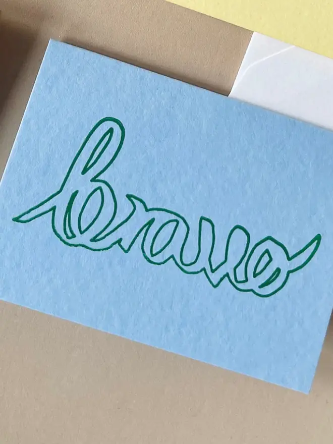 Bravo hand printed Card on a blue background. 