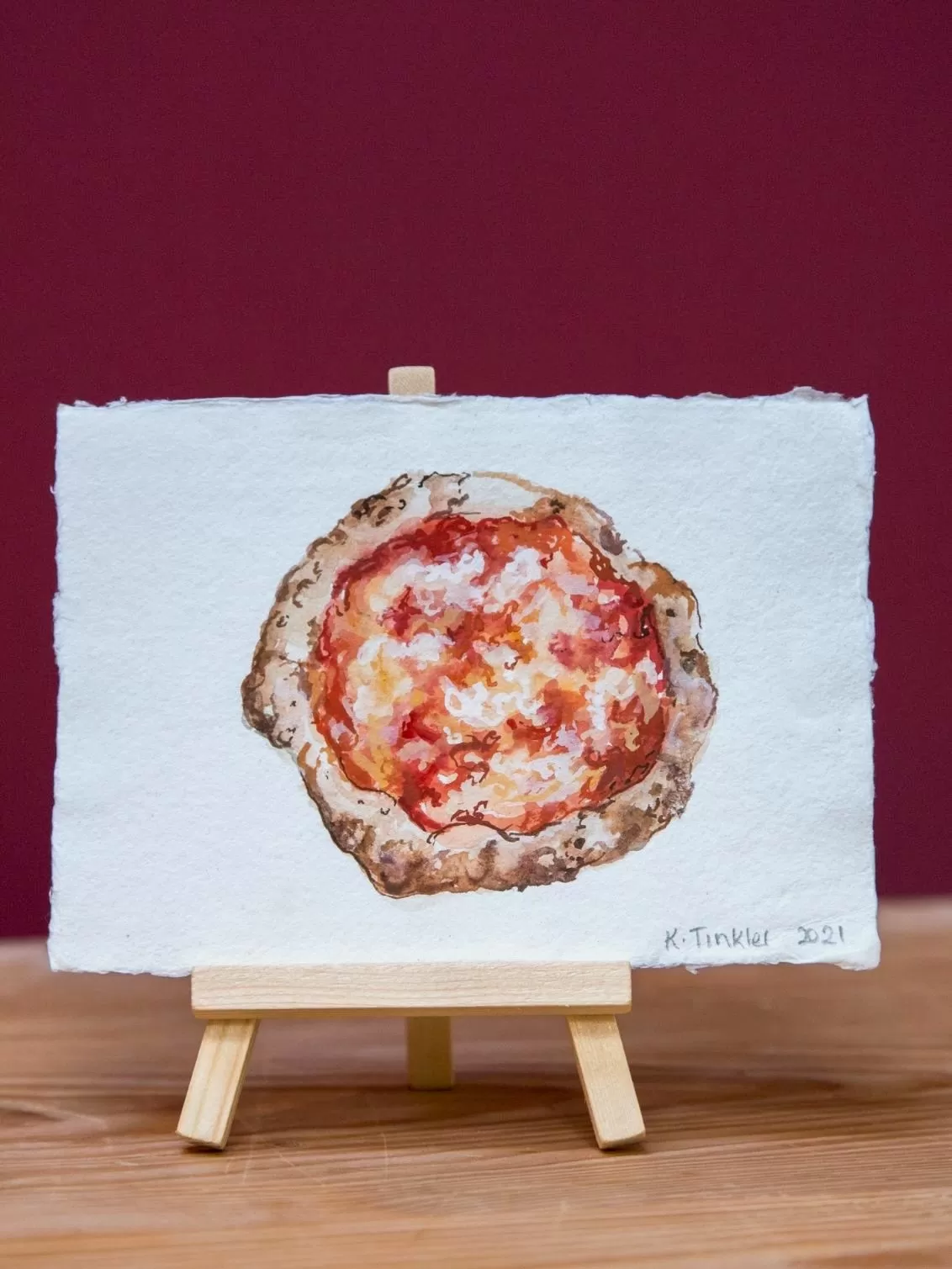 Katie Tinkler illustration of a margherita pizza,