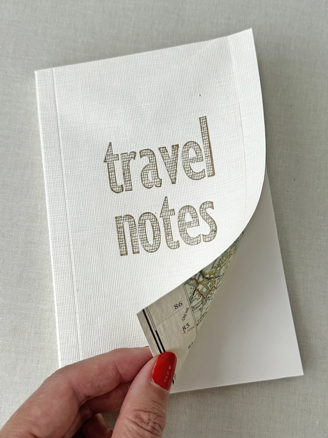 opening the front cover of the linen map notes book