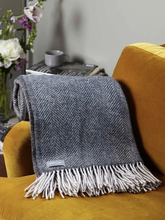 Organic Wool Throw, an organic wool throw sitting on a sofa. 