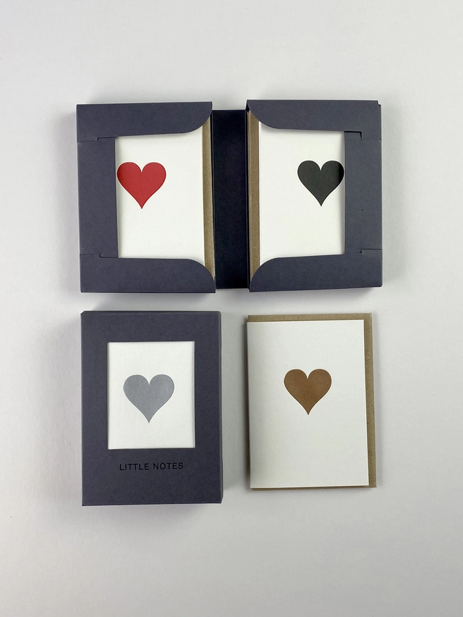 Open and closed gift boxes for little notes allowing you to see three of the four traditional heart designs in one box