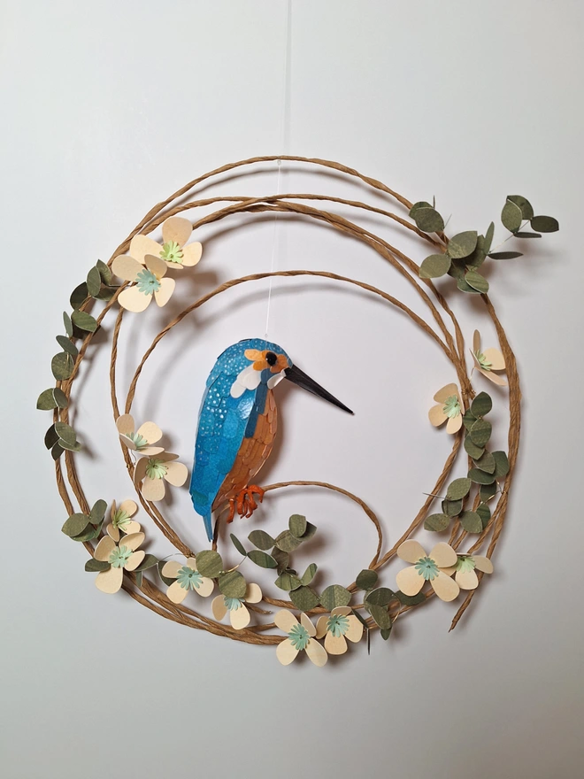 handmade kingfisher sculpture, perched on a floral wreath