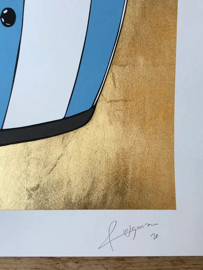 Motor cycle helmet with a star-and-stripe design on a gold background. 