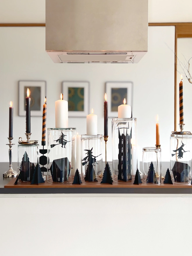 witch figures in glass jar