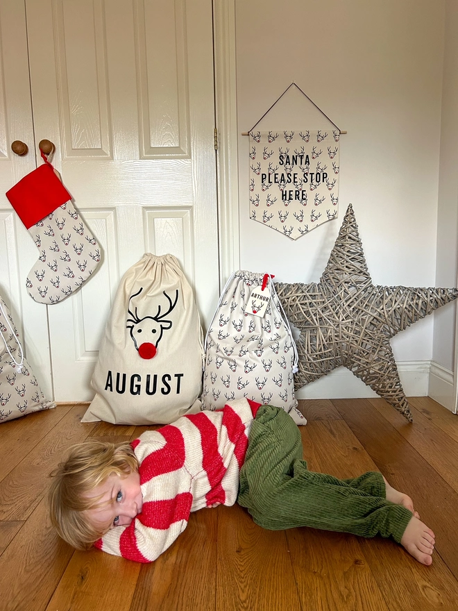 Santa Stop Here Fabric Wall hanging banner with reindeer design and matching personalised stockings and Christmas Sacks