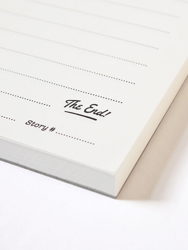 Odd Goose Super Short Stories creative writing notepad close up showing "the end!" lettering