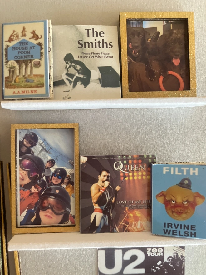 a wooden box with miniatures of the person favourite things inside. Each piece is handmade specially on request. bespoke art piece made by My Papercut Forest