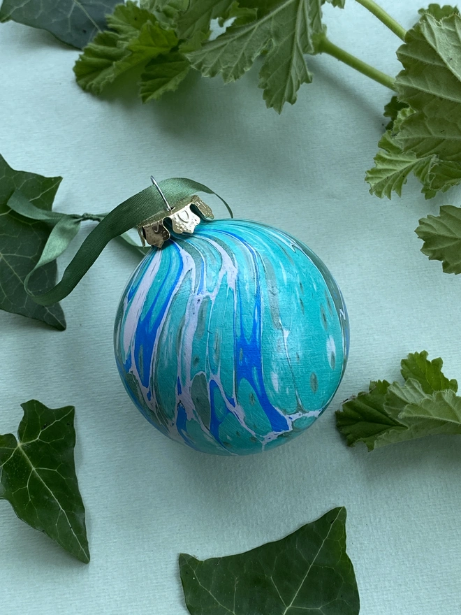 A large hand-marbled ceramic bauble