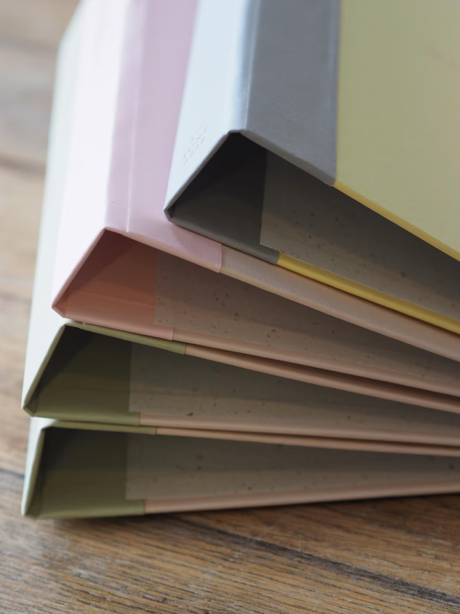 personalised wedding keepsake ring binder. a stack of personalised ring binders.