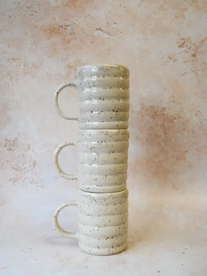 Speckle Pop’ handmade ceramic mugs — stacked set showing ribbed shape and speckled finish
