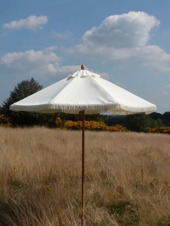 Double Cream Lampshade Parasol. A white parasol.
