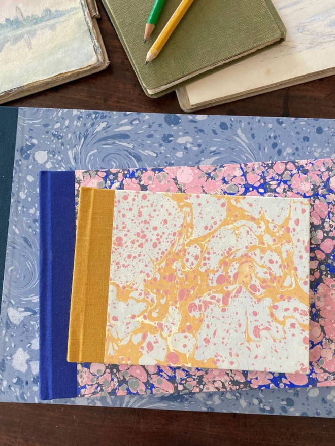 A6 Landscape Sketchbook. A stack of sketchbooks.