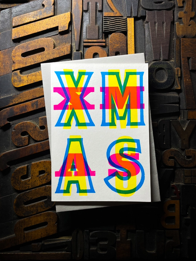 Festive Christmas typographic letterpress card with deep impression print. Very colourful and vibrant. With Cool Grey envelope.