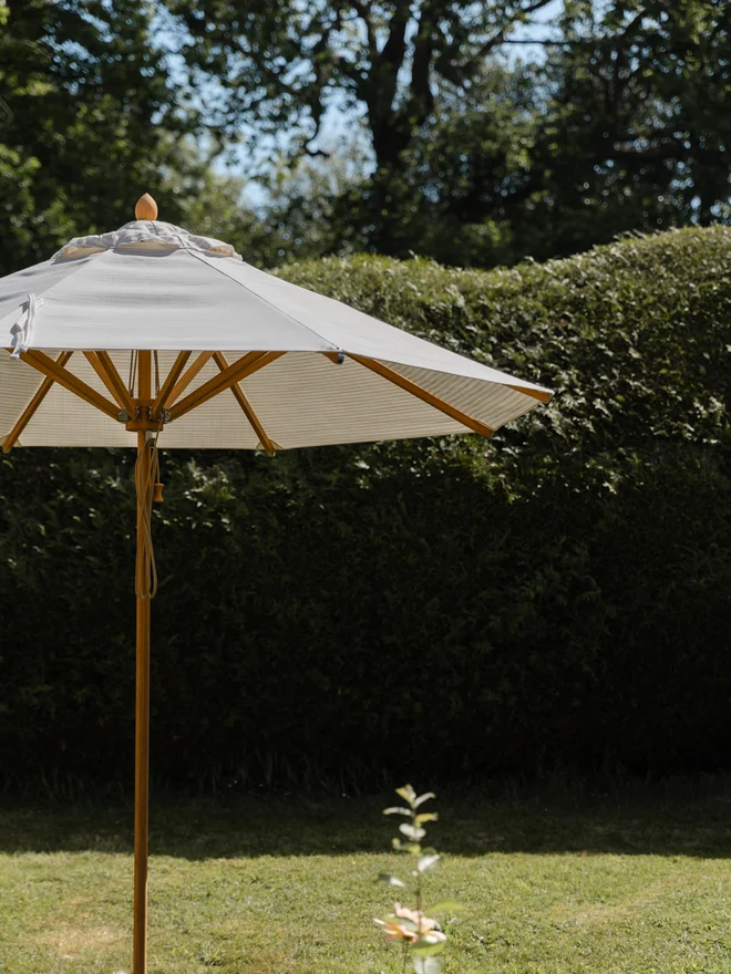 Beige and white striped parasol