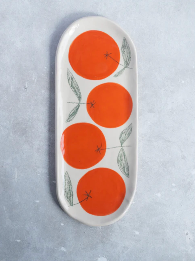 Large Orange Dish. A large dish with an orange design.