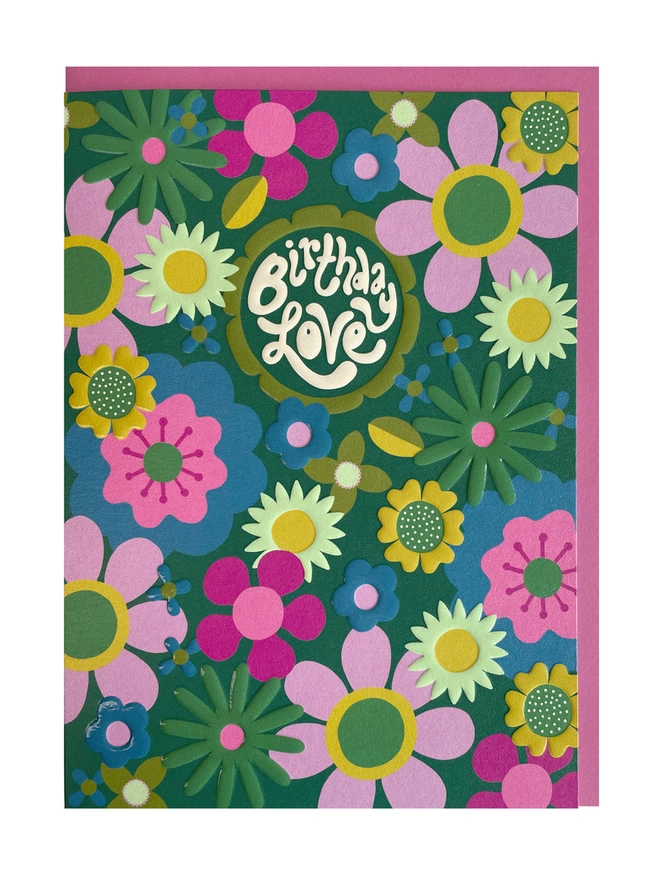 A vibrant Birthday card with a ‘Birthday Love’ message sitting within the centre of a flower, surrounded by a funky 70’s inspired floral pattern design, completed with a spot UV and embossed finish that really makes the birthday card shine
