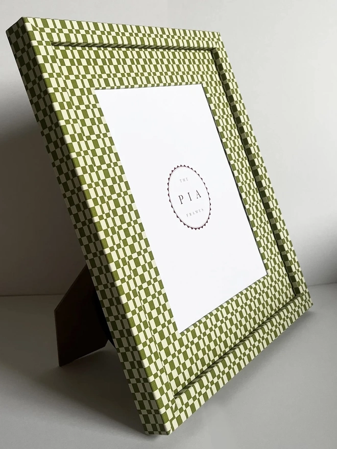 Green & Beige Checkered Frame, a colourful frame sitting on a plain white surface. 