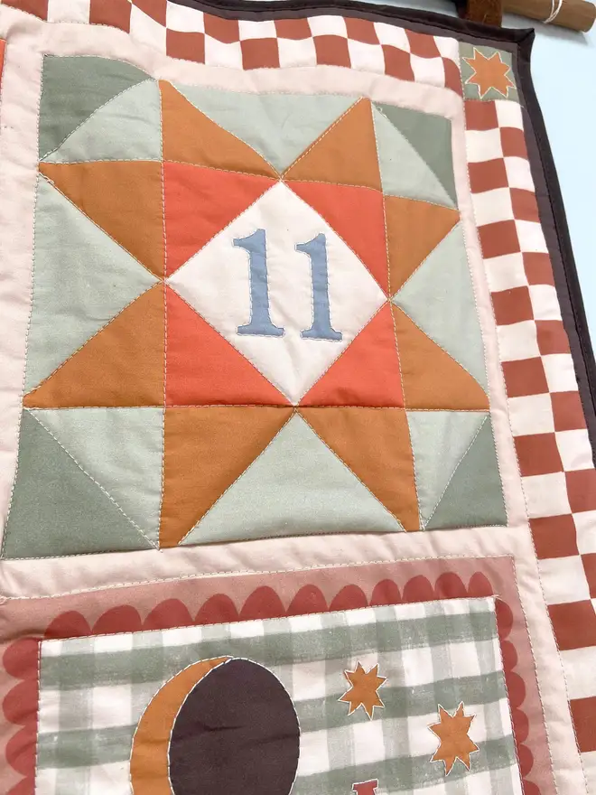 personalised baby quilted wall hanging. a patchwork hanging quilt decoration to commemorate a baby's birth.