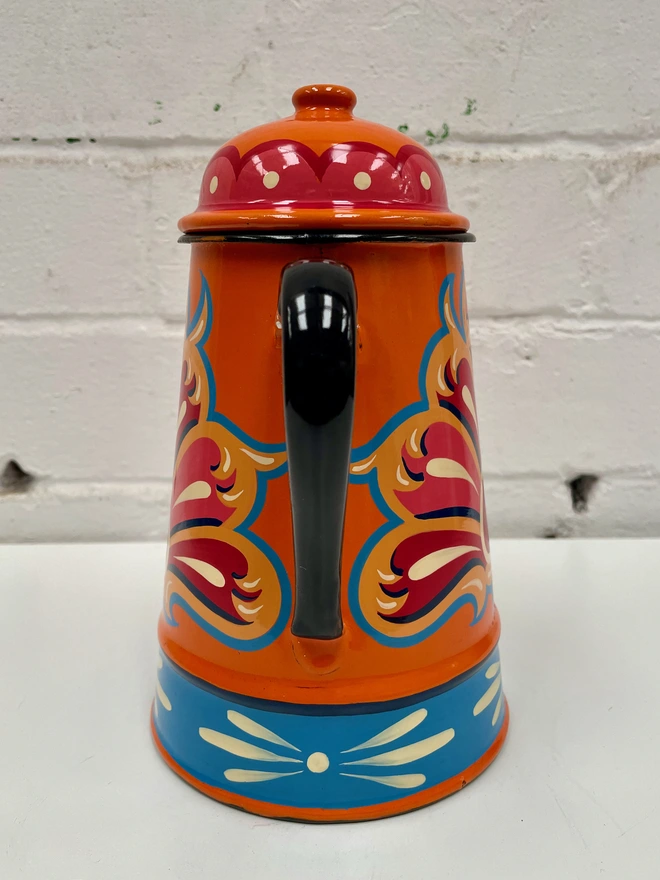 Vintage orange coffee pot, hand-painted with a traditional fairground design in pink, red and blue.