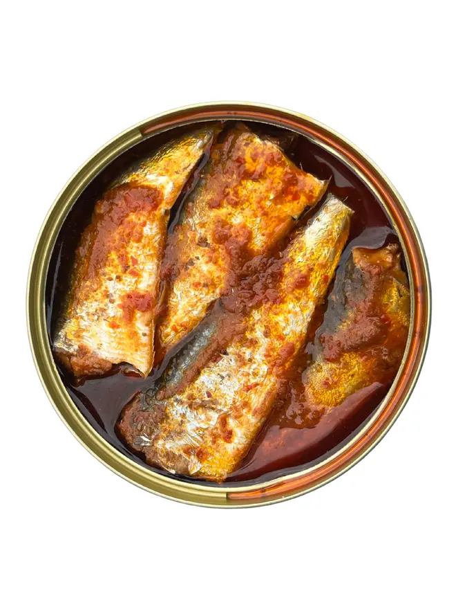 An open tin of Lamiri X Sea Sisters Cornish Sardines with Tunisian Harissa on a white background