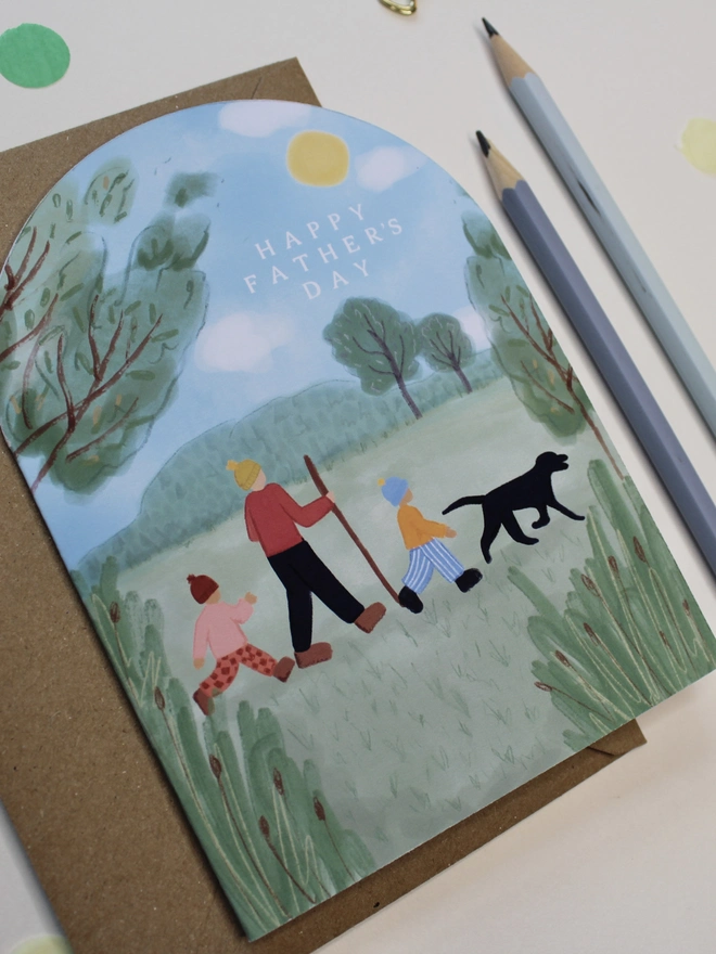 arch shape fathers day card featuring a family walk in nature