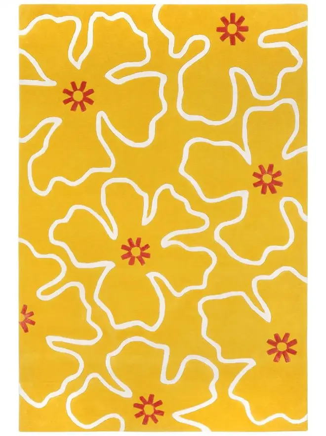 Hibiscus Hand Tufted Rug, a colourful rug on a plain surface. 