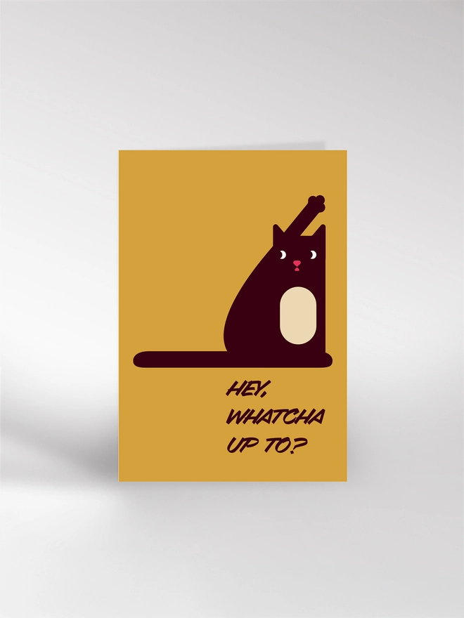 Greeting card featuring an illustrated cat with its leg in the air