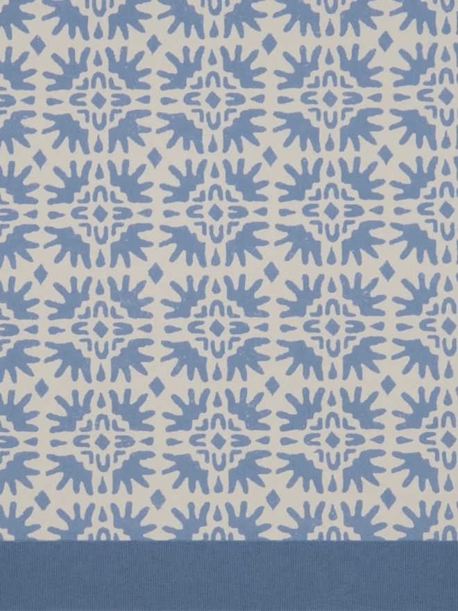 Retro Drum Lampshade. Close-up of a hand block printed lampshade showing a bold repeating geometric pattern. The colourful printed design and neat trim bring character and a handcrafted finish to any lamp.