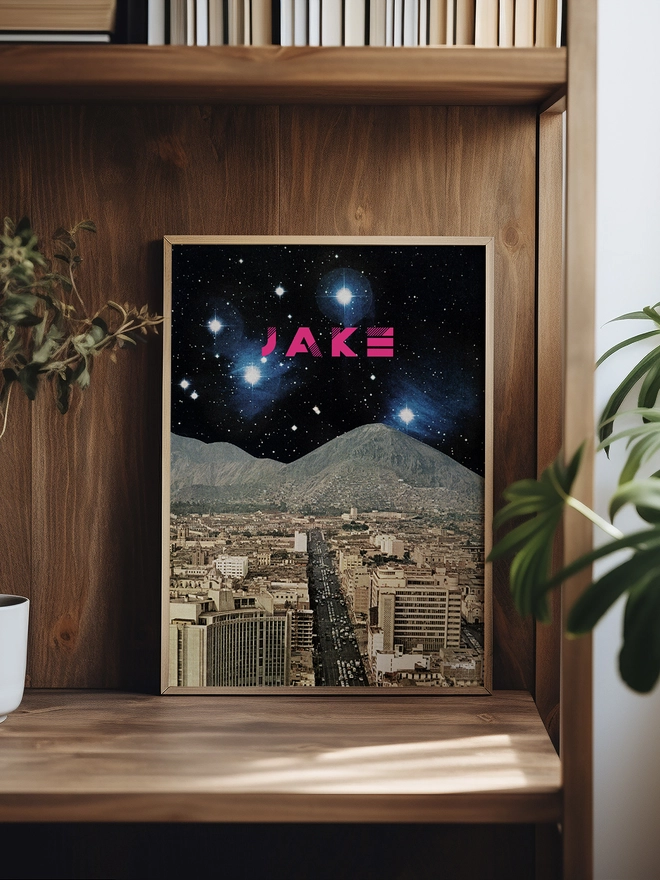 A personalised retro space print featuring a faraway planet deep in space. A bold name in hot pink sits among the stars.